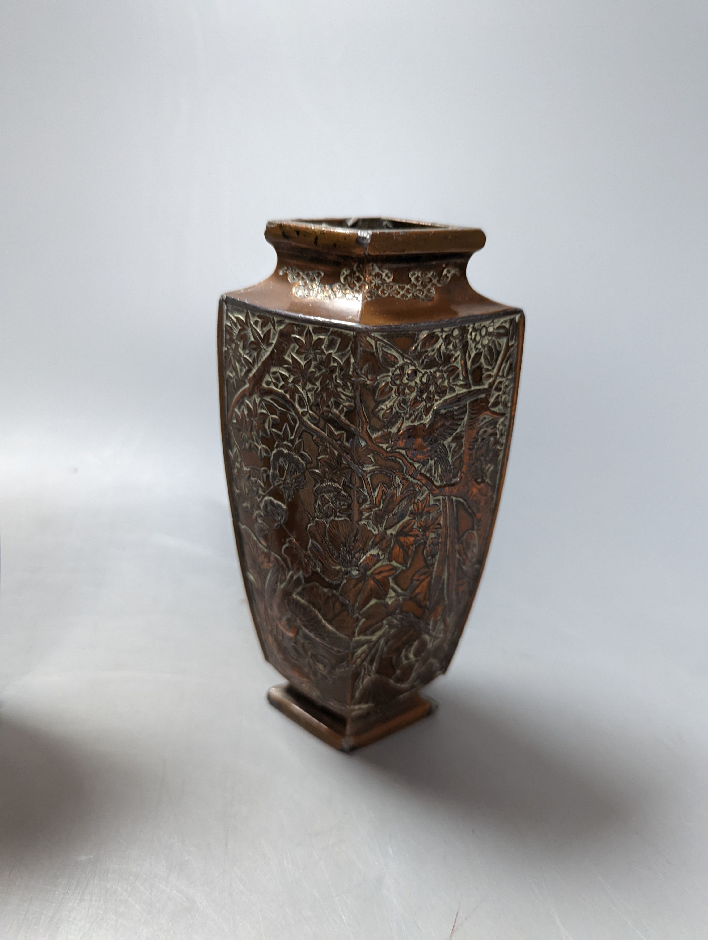 A Japanese bronzed antimony smoker's stand and a pair of vases, stand 19 cms wide.